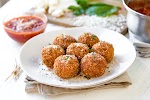 Crispy Arancini with Mozzarella, Spinach and Sun-dried Tomato was pinched from <a href="https://thecozyapron.com/crispy-arancini/" target="_blank" rel="noopener">thecozyapron.com.</a>