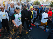 President Cyril Ramaphosa chats to members of the public during a morning walk in Cape Town.