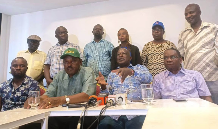 Former Kisumu governor Jack Ranguma, Kisumu Senator Fred Outa and former speaker Onyango Oloo during a press briefing in Kisumu on Tuesday