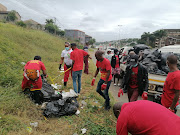 EFF members clean up parts of Overport in Durban as part of their Andries Tatane initiative to create awareness about the importance of clean communities.