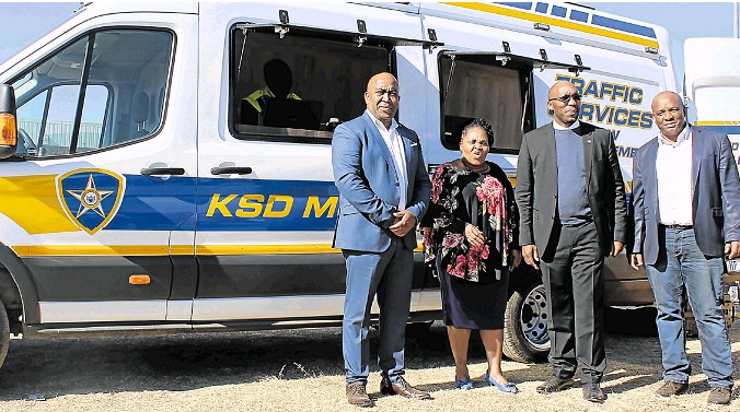 Micros Calabash director Sakhele Skenjana, Transport MEC Weziwe Tikana, KSD mayor Dumani Zozo and KSD acting municipal manager Mbulelo Sigaba next to a ‘roadblock bus’ purchased by the municipality, part of a new R120-million fleet unveiled recently.