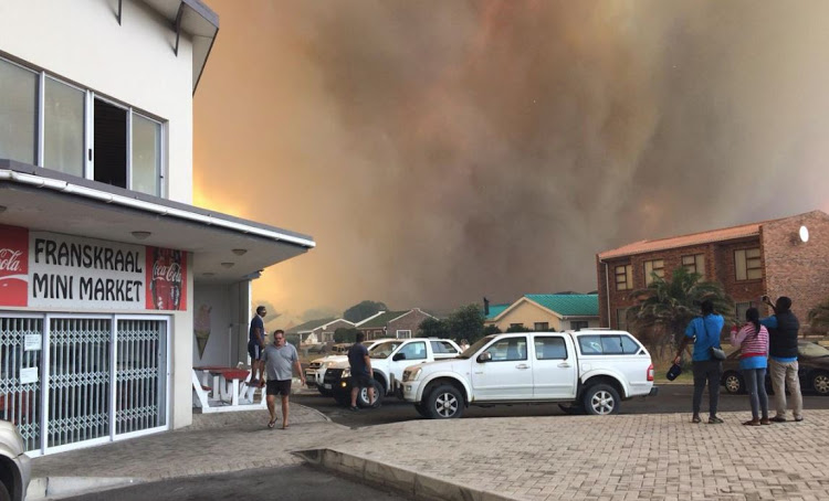 Smoke engulfs the coastal village of Franskraal, near Gansbaai on Friday.