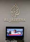 The logo of Qatar-based Al-Jazeera network is seen in one of their offices in Jerusalem June 13, 2017. 