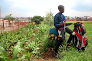 Thato Selobane  observes proceedings while waiting his turn.