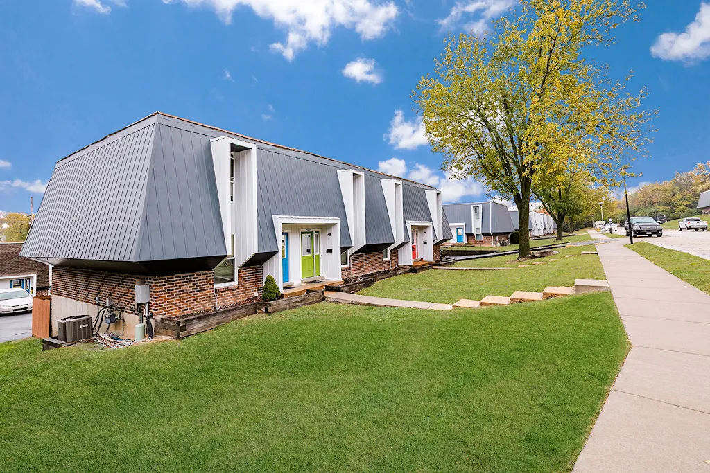 Exterior building view with green grass and blue sky