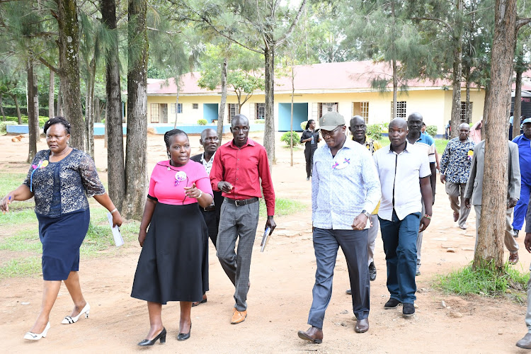 Busia Deputy Governor Arthur Odera (in cap) arrives in Moding High School on September September 9, 2022