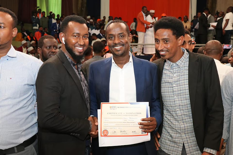 Former Al Jazeera journalist Mohamed Adow displays his ODM certificate on Wednesday, April 20.