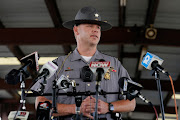 Lt. Nathan Dennis of the Ohio Highway Patrol speaks with reporters about the attempted attack on the FBI building in Cincinnati, at a press staging area near Wilmington, Ohio, U.S., August 11, 2022.  