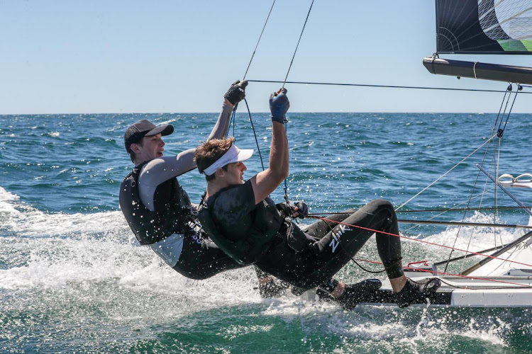 Sailors Benji Daniel and Alex Burger are hoping to qualify for the postponed 2020 Olympics in Tokyo.