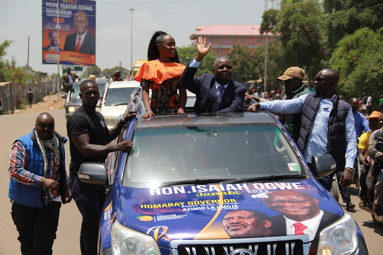 Homa Bay governor aspirant Isaiah Ogwe with his daughter Joyce Ochieng during Ogwe campaign launch for the seat in Homa Bay town on March 19,2022