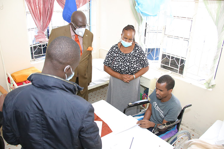 Education CS George Magoha pays a courtesy visit to a KCPE 2022 candidate, Abdullahi Noor Warsame, who suffered a stroke a few days earlier. HE was able to sit the exams at Woodstreet clinic and nursing home at Eastleigh in Nairobi on March 9.