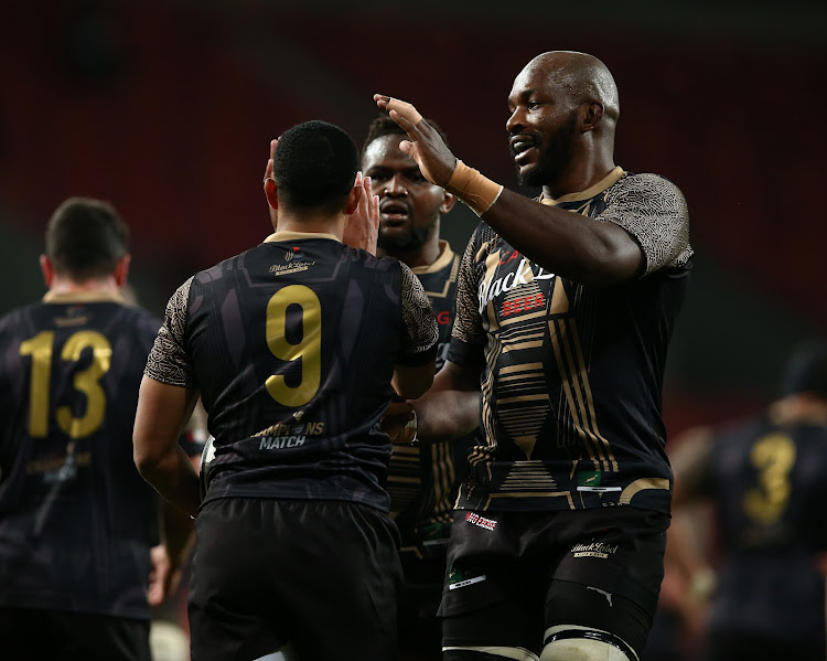 Teammates congratulate try scorer Keagan Johannes of Carling Champions Team during the Carling Champions Match against Italy A at Nelson Mandela Bay Stadium on July 02 in Gqeberha.