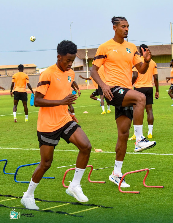 Ivory Coast's Simon Adingra and Sebastian Haller during a warm up session