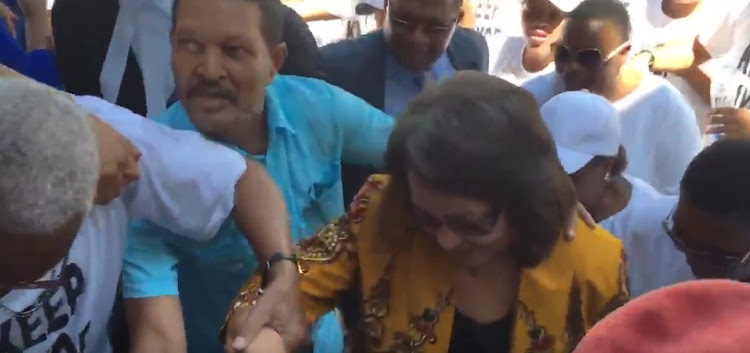 Cape Town mayor Patricia de Lille being escorted through a crowd of supporters as she arrived at the High Court in Cape Town. Image: Screen grab of Twitter video.