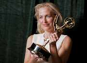 Gillian Anderson poses with her Emmy award for Outstanding Supporting Actress in a Drama Series, backstage at the Netflix UK Primetime Emmy for 