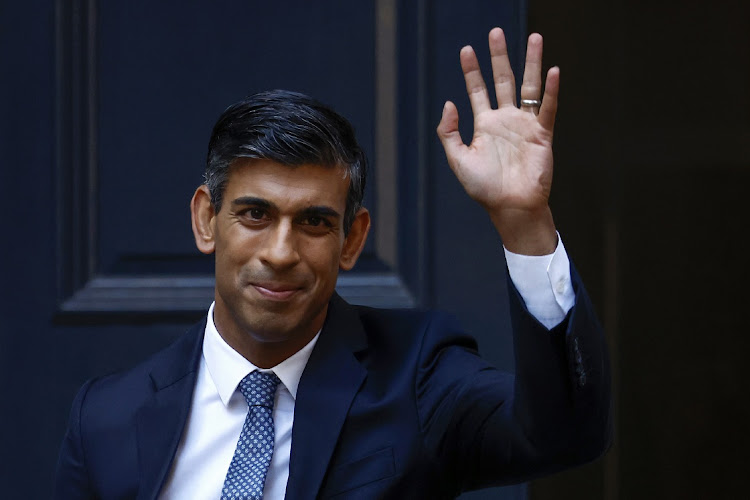New Conservative Party leader and incoming prime minister Rishi Sunak waves as he departs Conservative Party Headquarters on October 24 2022 in London.