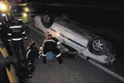 DEADLY SCENE: A car overturned after it allegedly collided wopth the Armco barriers on the N1 south near the Allandale off ramp. 02/08/2009. © Unknown.