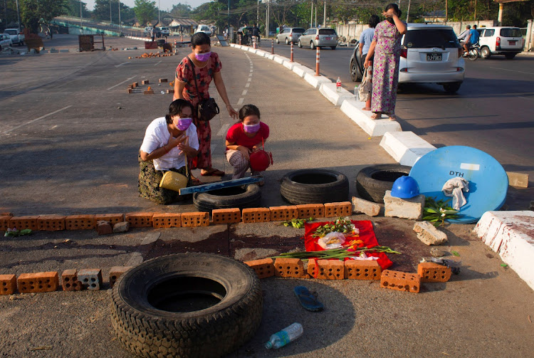 Family members near a spot where a protester was killed during a protest against the military coup in Yangon, Myanmar, on March 4 2021. Picture: REUTERS