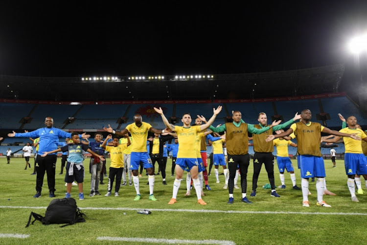 Mamelodi Sundowns head coach Pitso Mosimane,his family and kids with Sundowns players sings during the CAF Champions League match between Mamelodi Sundowns and Leones Vegetarianos at Loftus Stadium on December 05, 2018 in Pretoria, South Africa.