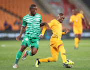 Bloemfontein Celtic midfielder Lantshene Phalane (L) fights for the ball with Kaizer Chiefs star forward Khama Billiat (R) during the Absa Premiership match at FNB Stadium in Johannesburg on August 29 2018.