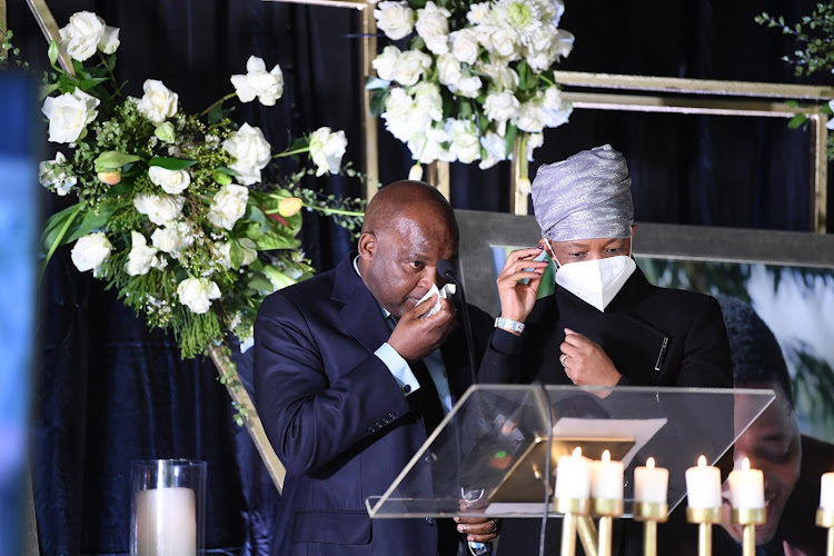 Al Ahly coach Pitso Mosimane and his wife Moira Tlhagale during the memorial service of former Mamelodi Sundowns communications manager Thulani Thuswa at Nasrec Memorial Park in Johannesburg on June 9 2021.