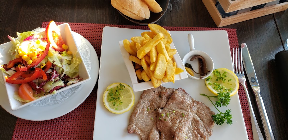 Unbreaded wiener schnitzel, fries, salad, and GF bread