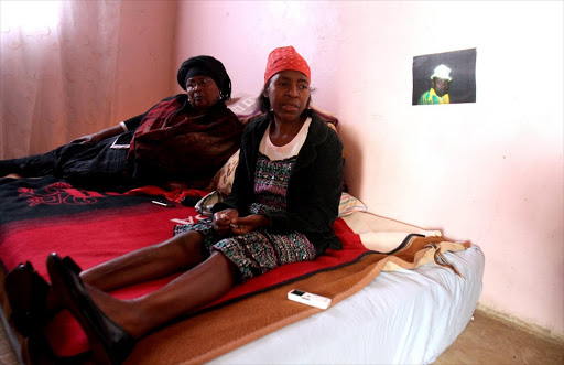 Zodwa Moloi, right, the mother of Lerato Moloi - who was found murdered at the weekend, is supported by Thandi Mathanjana at her home in Protea, Soweto. Picture Credit: Sandile Ndlovu