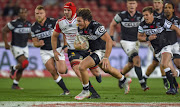 Marius Louw of the Cell C Sharks on the attack during the Currie Cup match between Xerox Golden Lions and Cell C Sharks at Emirates Airline Park on August 12, 2017 in Johannesburg, South Africa.