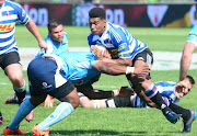 Edgar Marutlulle of the Blue Bulls tackles Damian Willemse of WP during the Currie Cup match between Vodacom Blue Bulls and DHL Western Province at Loftus Versfeld on October 01, 2017 in Pretoria, South Africa. 