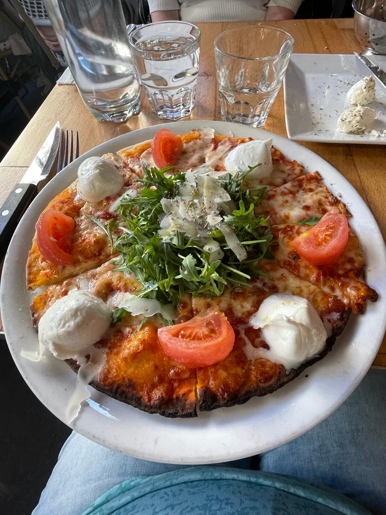 Pizza with tomatoes and mozzarella