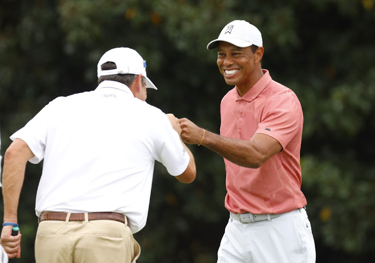 Tiger Woods of the US and Spain's Jose Maria Olazabal on the putting green ahead of a practice round at Augusta National Golf Club on November 10, 2020