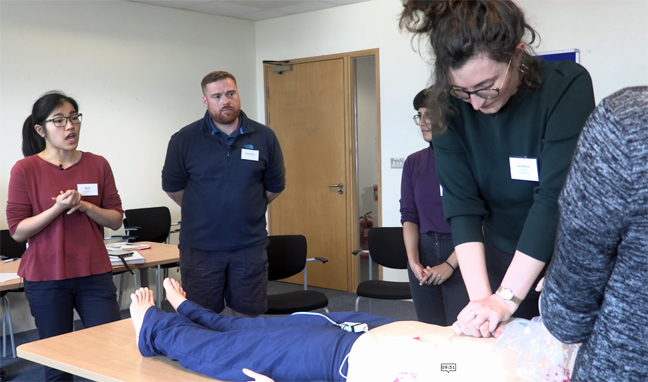 Junior doctor leading a team of fellow learners in a simulated cardiac arrest