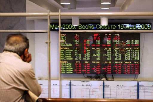 An investor monitors the digital board at the Nairobi Securities Exchange