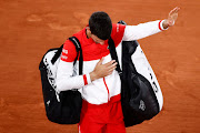 Novak Djokovic leaves court after winning his semi final match against Rafael Nadal.