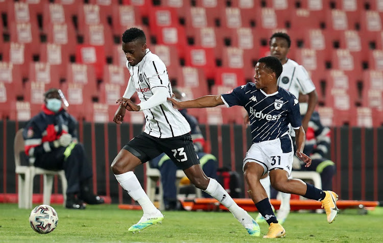 Innocent Maela of Orlando Pirates challenged by Rowan Human of Bidvest Wits during the Absa Premiership match between Orlando Pirates and Bidvest Wits at Emirates Airline Park on August 15, 2020 in Johannesburg, South Africa.