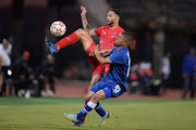 Roscoe Pietersen of Chippa United and Grant Margeman of SuperSport United during the DStv Premiership match at Lucas Moripe Stadium on August 7 in Pretoria.