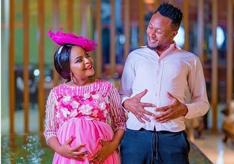 Size 8 and DJ Mo flaunt the artiste's baby bump.