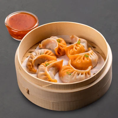 Steamed Chicken Schezwan With Momo Chutney