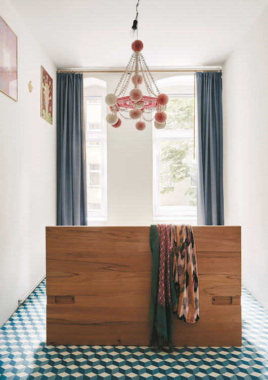 The pająk (above the bed) was traditionally hung in the homes of rural Poles to celebrate the harvest.