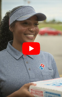 Woman delivering Domino’s pizza