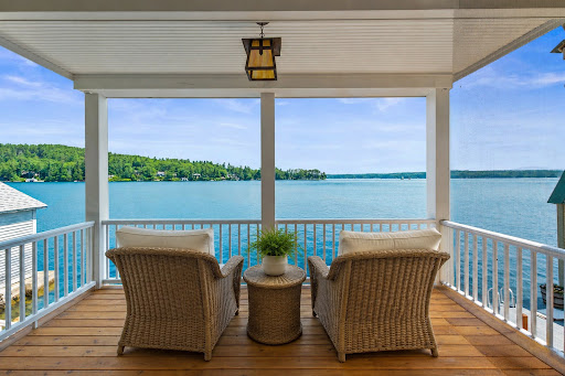 Balcony with lake and forest view in this luxury house for sale in Sunapee ($2,295,000)