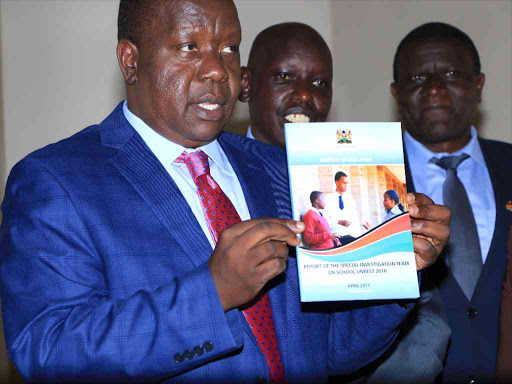 Education CS Fred Matiang'i receives a task force report on last year's school fires at KICD in Nairobi, May 19, 2017. /EMMANUEL WANJALA