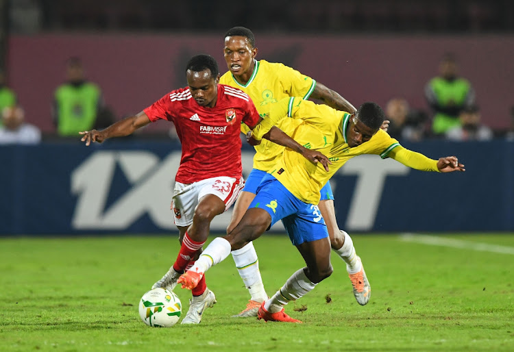 Neo Maema of Mamelodi Sundowns and Percy Tau of Al Ahly during the CAF Champions League match between Al Ahly and Mamelodi Sundowns at Al Salam Stadium on February 25, 2023 in Cairo, Egypt.