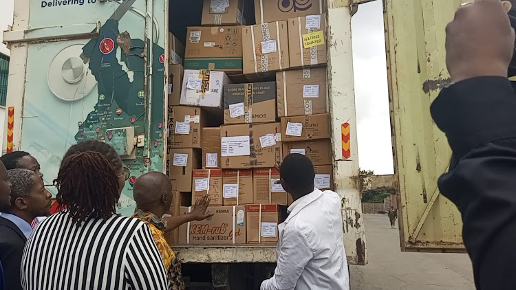 Makueni County Governor Prof Kivutha Kibwana and KEMSA CEO Terry Ramadhani flag off a medical supplies consignment to Makueni at the Authority’s Embakasi national supply chain centre on June 6, 2022