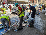 Law enforcement seizes counterfeit goods in the Joburg CBD. 