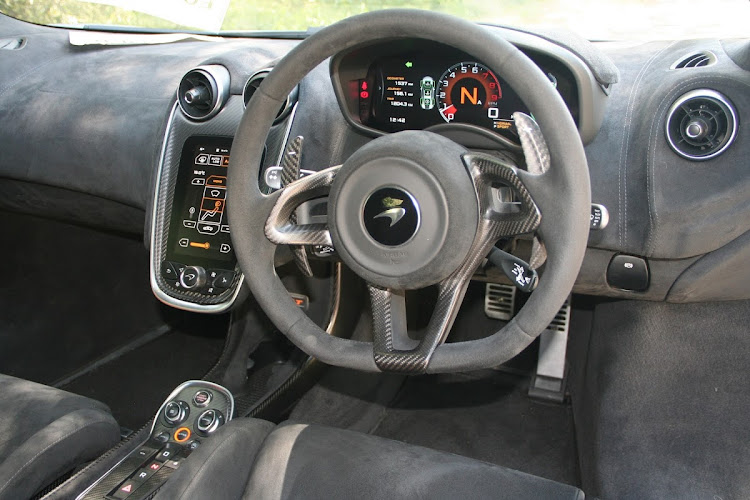 Carbon fibre and alcantara trimmings make for a racy mood in the cockpit.