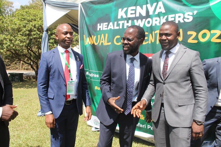 Kenya Union of Clinical Officers chairman Peterson Wachira, Kisumu governor Anyang' Nyong'o and Kenya Medical Practitioners, Pharmacists and Dentists' Union (KMPDU) Secretary General Davji Atellah during Kenya Health Workers Annual Conference at Safari Park Hotel, Nairobi on March 16, 2022/ANDREW KASUKU