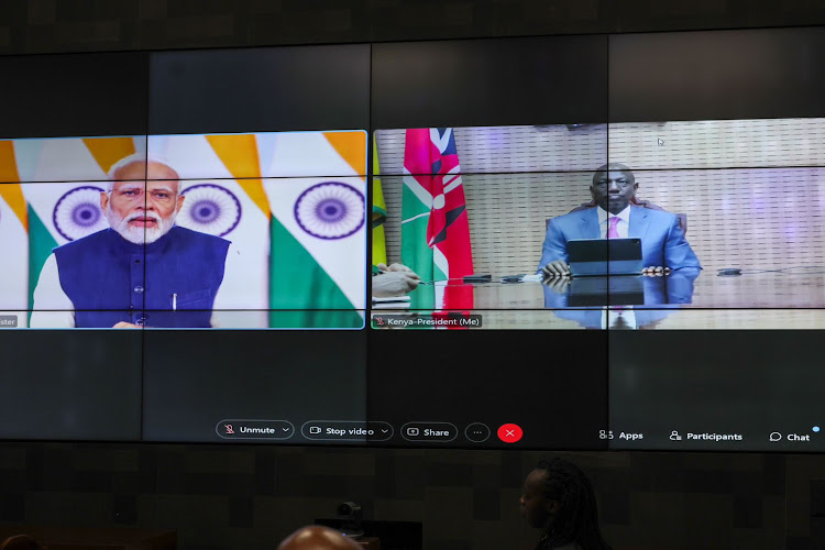 India's Prime Minister Narendra Modi and President William Ruto on a virtual call with during the Second Voice of Global South Summit on November 17, 2023.