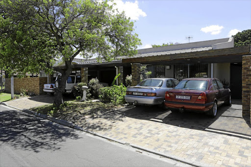 The house in Goodwood and some of the 13 cars that form part of the estate Pierre Koekemoer left to the SPCA.