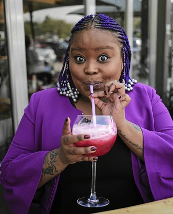 Lesego Tlhabi sips juice at Tashas, just like her alter ego, Coconut Kelz, would.